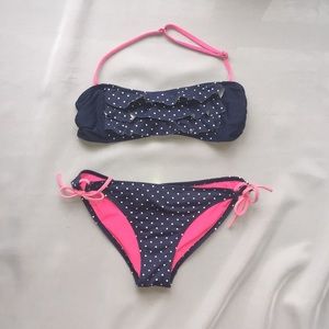 Pink and navy blue and white polka dot swimsuit